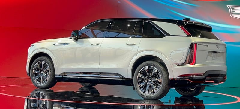Why We're So Excited to Drive the Cadillac Escalade IQ... It'll Be Worth the Wait 3 A Side View Of The 2025 Cadillac Escalade Iq