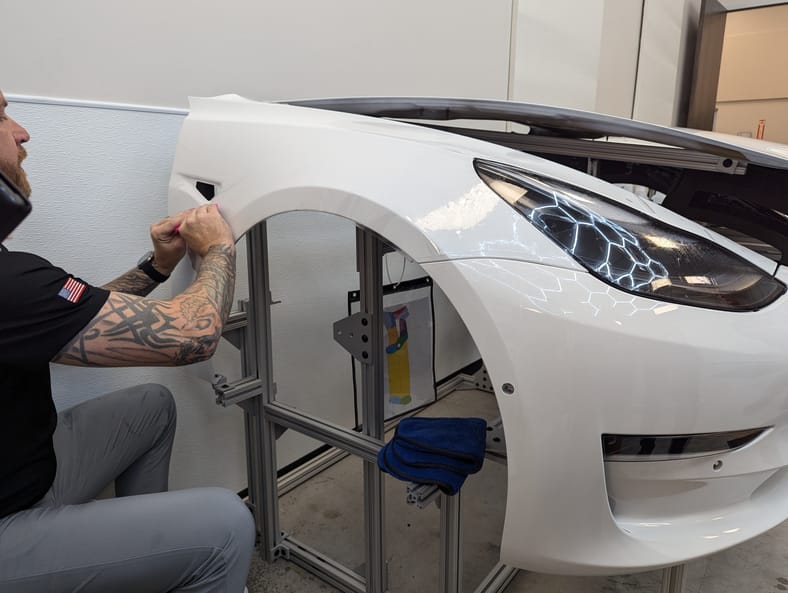 I Can Wrap a Car, But Can I Apply Paint Protection Film To Save My Car's Paint? 6 A Student Applying Paint Protection Film At The Xpel Lab