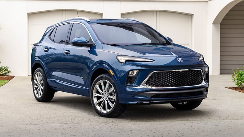 Safest Cars On the Road Under $30,000: These Cars Are Loaded with Safety Tech and Features 13 The New 2024 Buick Encore Gx In A Beautiful Blue Color, Standing At An Angle Mostly Facing The Camera Is Among The Safest Cars On The Road