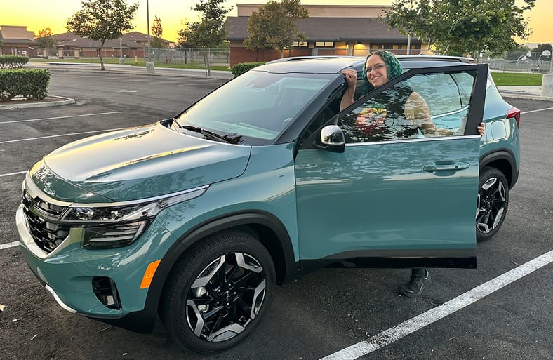 Safest Cars On the Road Under $30,000: These Cars Are Loaded with Safety Tech and Features 11 Featured Image - Liv Leigh Smiles While Hopping Into The 2024 Kia Seltos Sx Turbo Safest Cars On The Road