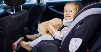 Tips for Keeping Kids Safe from Heat Stroke in a Hot Car 13 Baby In Car Seat Holding A Teddy Bear