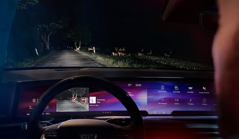 Why We're So Excited to Drive the Cadillac Escalade IQ... It'll Be Worth the Wait 11 Front-Facing View Of The Pillar-To-Pillar Screen In The Cadillac Escalade Iq Sport At Night With Night Vision Activated.