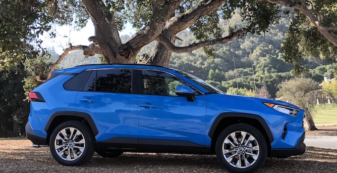 Which 2 Row SUVs Are Best For Child Car Seats? The Ultimate Car Seat Challenge 22 2019 Toyota Rav4 Compact Suv In Blue And Parked By A Tree