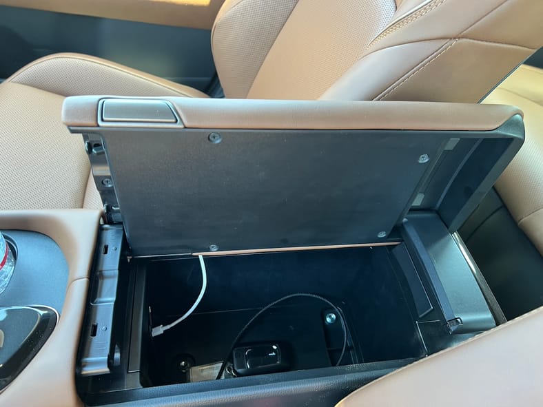 Shhh... the 2025 Toyota Crown Signia Delivers Low-Key Luxury Without the Flash 13 The Center Arm Rest Opens To Either Side In The 2025 Toyota Crown Signia