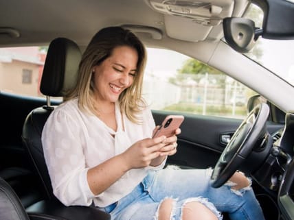 Need an Oil Change? New Tires? 4 Awesome Car Maintenance Apps to Keep your Car Running Smooth 8 Woman Looking At Phone