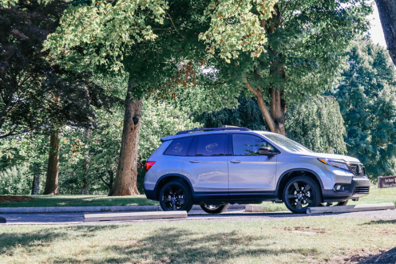 Which 2 Row SUVs Are Best For Child Car Seats? The Ultimate Car Seat Challenge 12 Sideview Of A Parked Two-Row Honda Passport